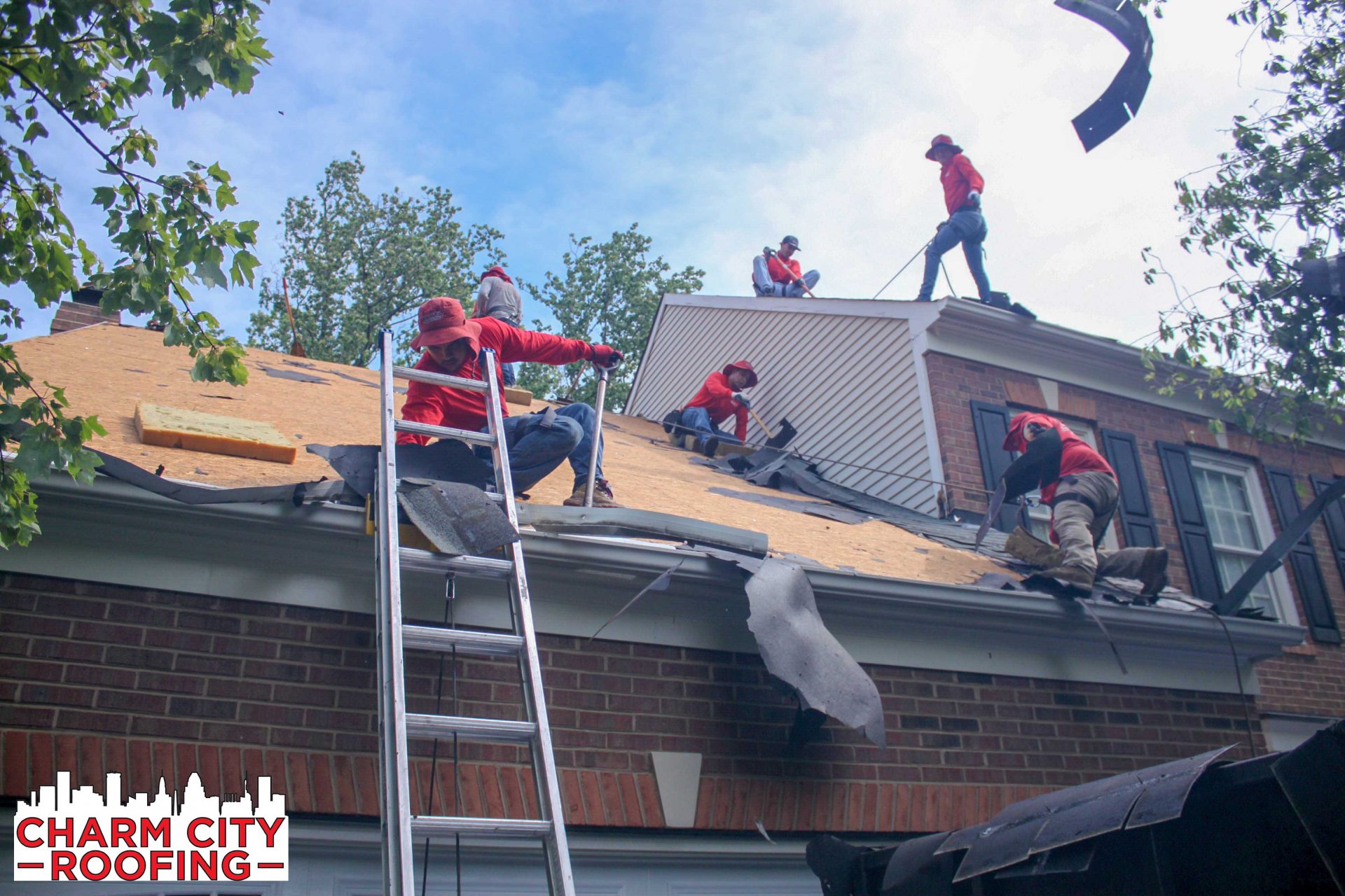 Charm City Roofing Crew Removes layers of old shingle roof