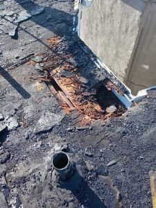 Damage to this Baltimore City Flat Roof has rotted a hole in the roof decking