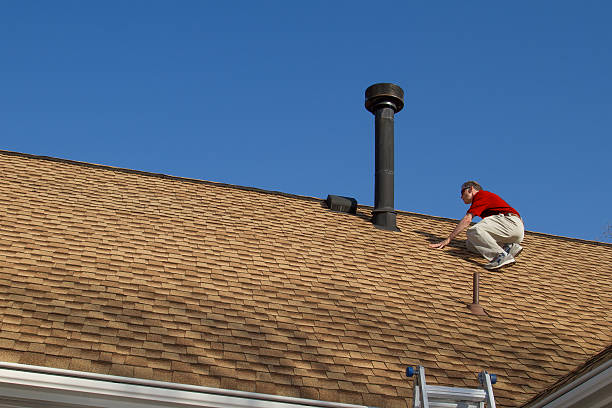 Roofing Estimator Inspecting Roof