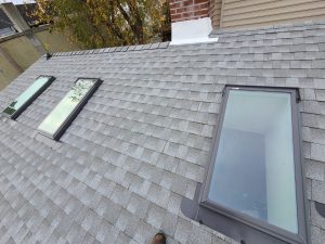 New skylights installed as part of a shingle roof replacement